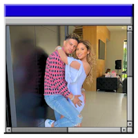 a man and woman are posing for a picture