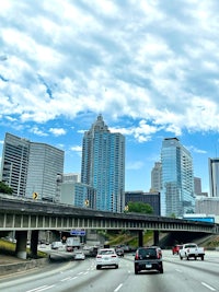 atlanta skyline with cars driving on a freeway