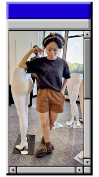an image of a woman standing next to a mannequin
