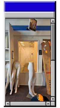 a room with mannequins and a tv