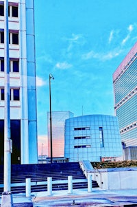 a building with a clock tower in the background