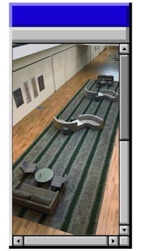 a computer screen showing a room with couches and chairs